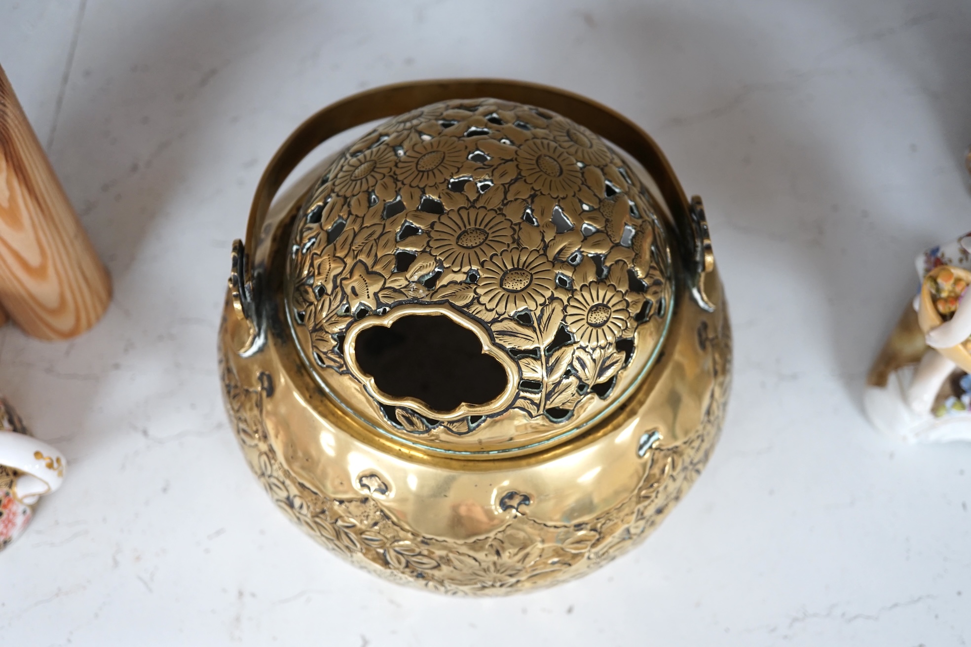 A Chinese brass basket censer and cover, 13cm high. Condition - fair.